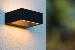 Goa Antrasitt utendørslampe Fra Lucide - Den unike formen med den sentrale åpningen skaper et symmetrisk og koselig lys.