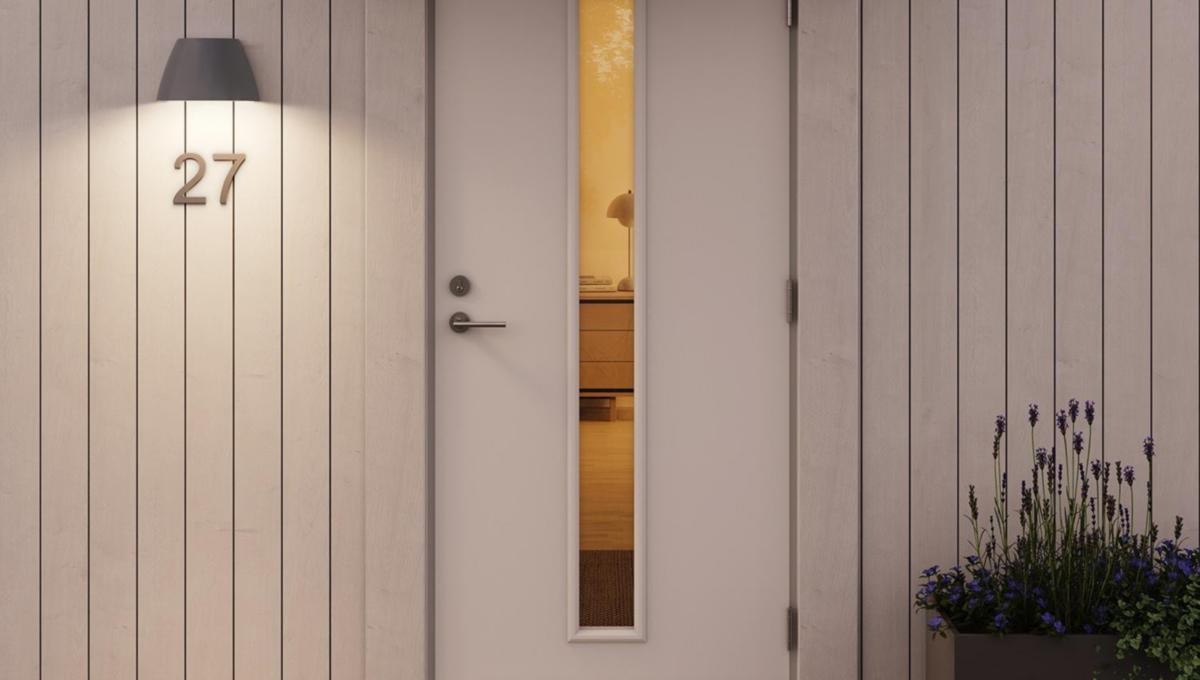 Vegglampe OUT-02 Grå Fra Plejd - OUT-02 er en smart vegglampe for utend&oslash;rs bruk med justerbar hvit belysning og innebygd LED, laget for &aring; lyse opp fasader, for eksempel.