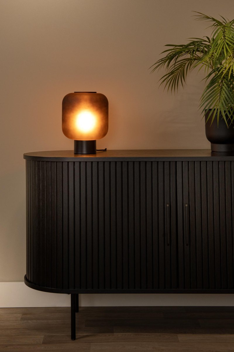 Eloise 27cm Svart bordlampe Fra Lucide - Eloise er laget av røkt glass av høy kvalitet, og gir en atmosfærisk og varm belysning som enkelt kan justeres til dine behov.