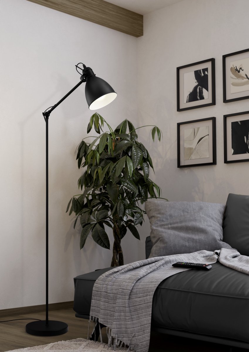 Priddy Svart gulvlampe Fra Eglo - Den hvite innsiden av skjermen gir et mykt og behagelig lys, mens lampen blir en stilig detalj i rommet.
