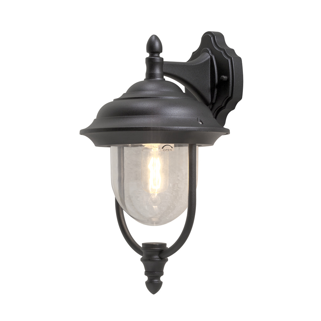 Parma Svart utendørslampe Fra Konstsmide - Med sin vakre form og klare glasskuppel sprer den et varmt og innbydende lys, ideelt for innganger og uteplasser.