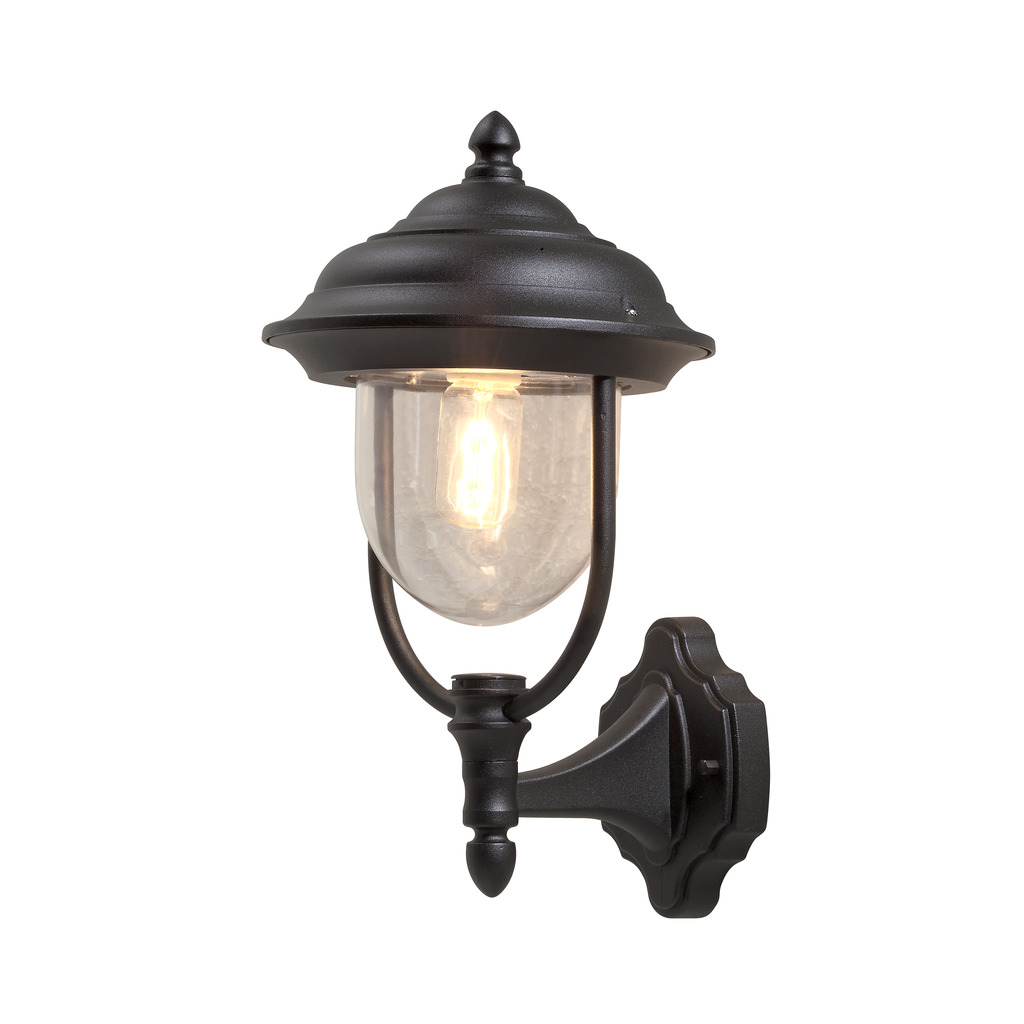 Parma Svart utendørslampe Fra Konstsmide - Med sin vakre form og klare glasskuppel sprer den et varmt og innbydende lys, ideelt for innganger og uteplasser.