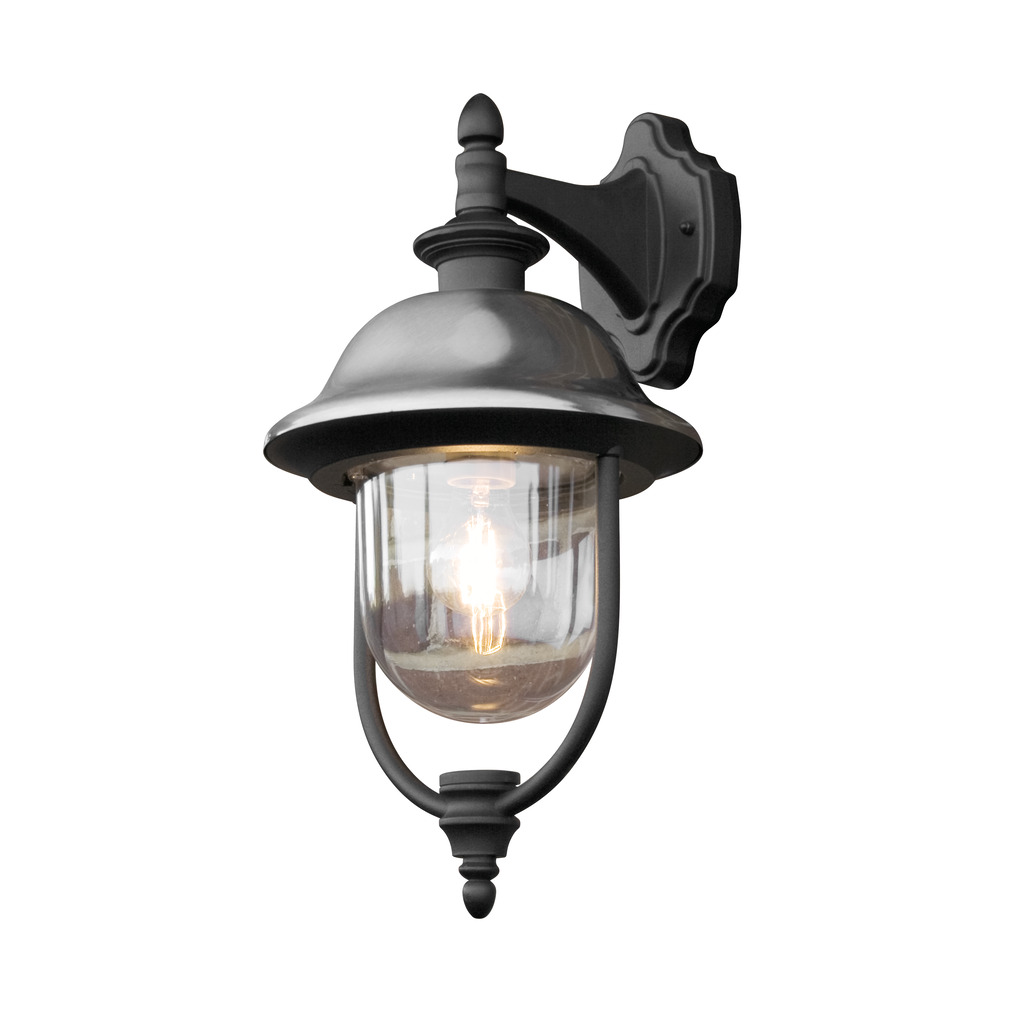Parma Svart utendørslampe Fra Konstsmide - Med sin robuste svarte finish og klare glasskuppel sprer den en varm og innbydende glød, og skaper en innbydende atmosfære ved inngangen eller uteplassen.