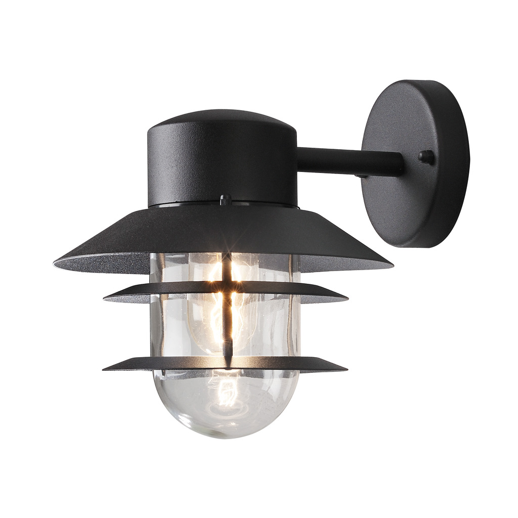 Modena Svart utendørslampe Fra Konstsmide - Med sitt beskyttende tak og stilige design gir den et behagelig og rettet lys, ideelt for å skape en trygg og innbydende atmosfære utendørs.