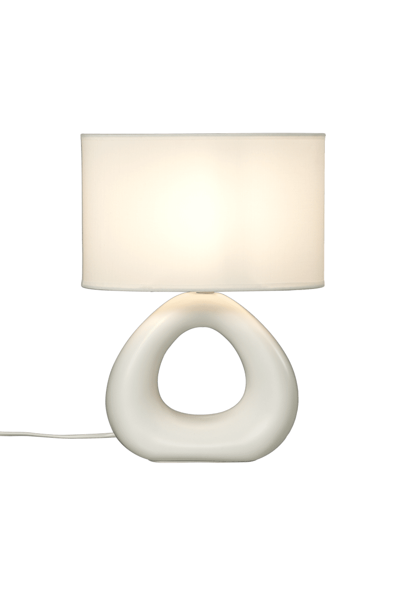 Eleni 35cm Naturlig hvit bordlampe Fra Aneta Lighting - Med sin unike, avrundede base i myke linjer og en elegant, enkel lampeskjerm gir Eleni et behagelig lys som skaper en varm og innbydende atmosf&aelig;re.